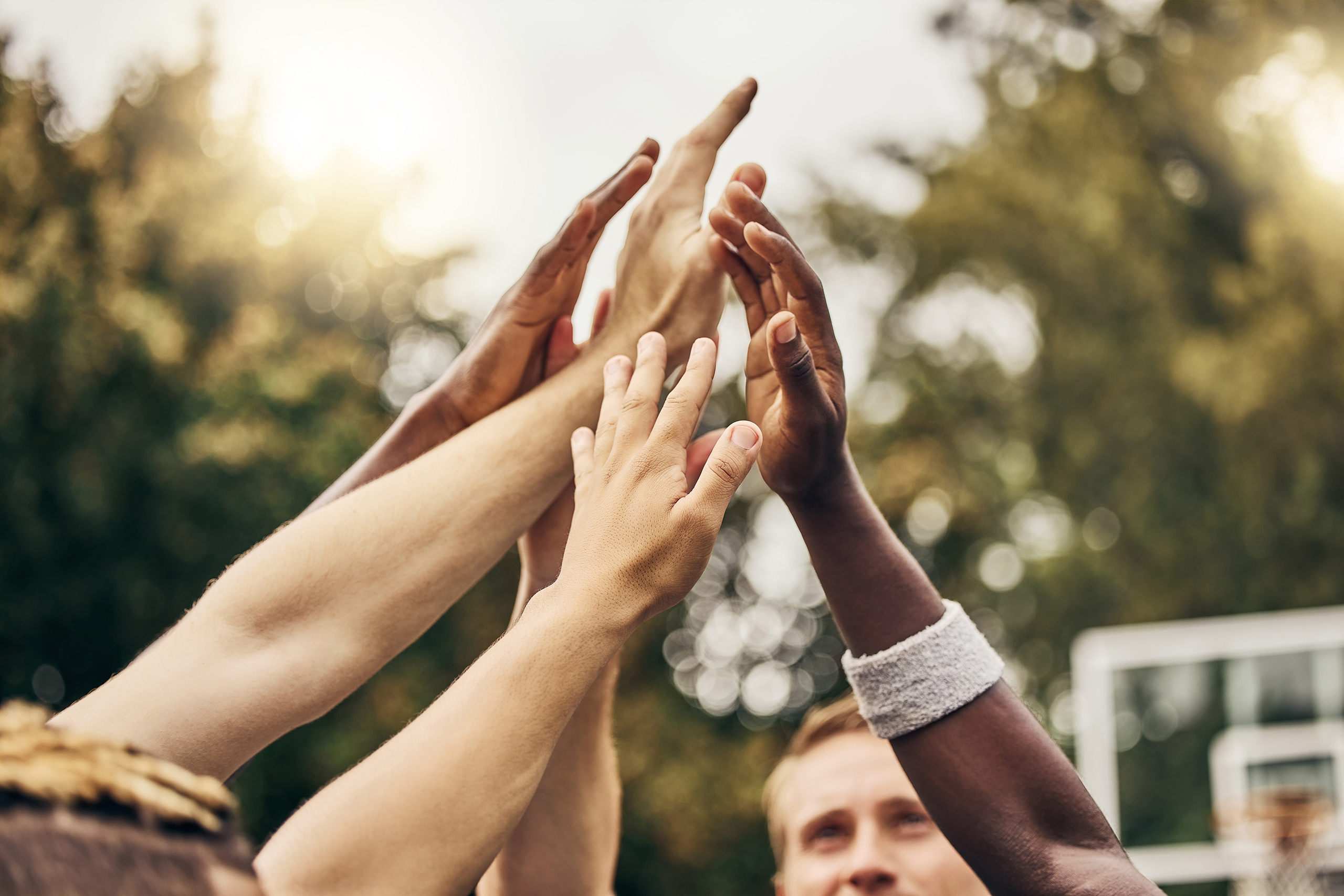 Hands gathered in a care community